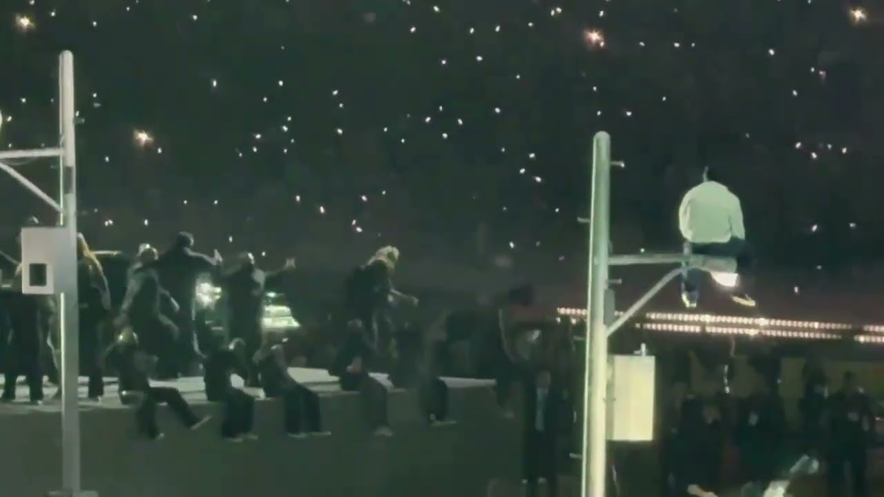 Super Bowl protestor charged by cops after waving political message during Kendrick Lamar show Super Bowl protestor charged by cops after waving political message during Kendrick Lamar show